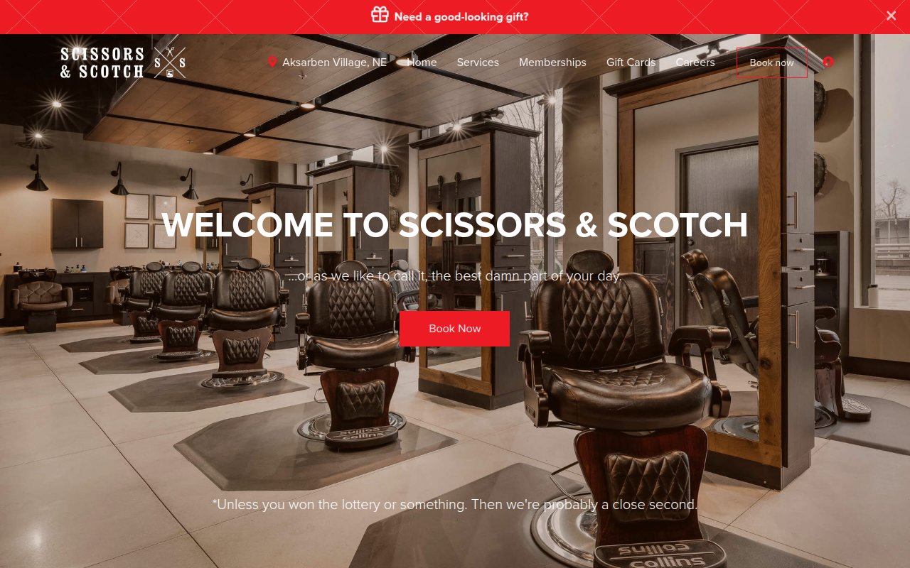 Scissors & Scotch homepage with bold brand voice and Book Now CTA
