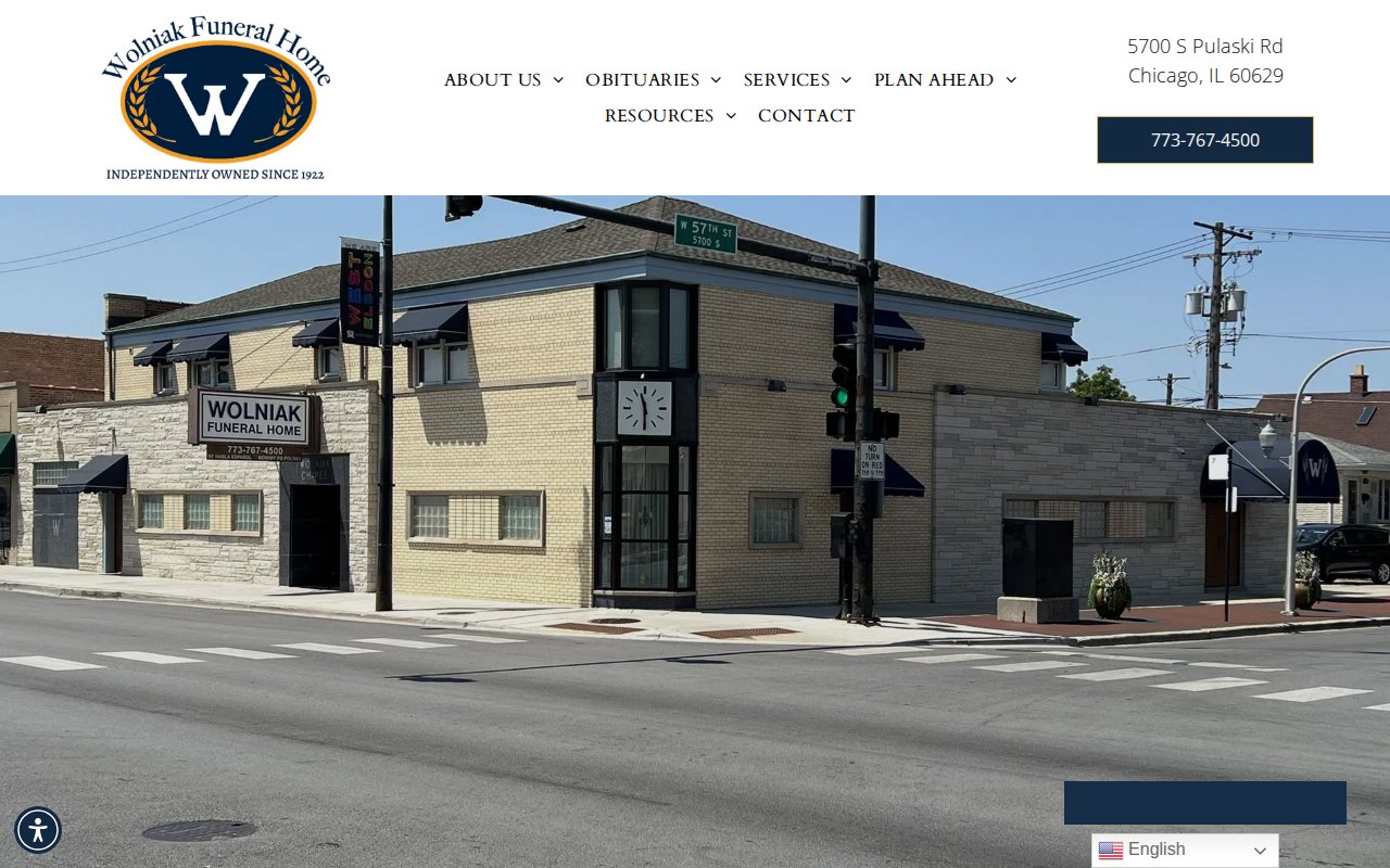 Wolniak Funeral Home homepage with comprehensive navigation including veteran services and grief resources