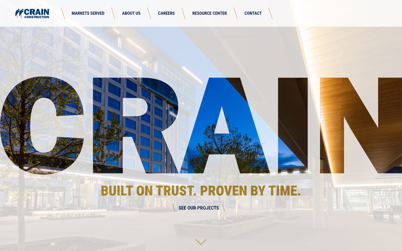 Crain Construction homepage with animated stats, 90-year heritage, and Hilton Worldwide testimonial