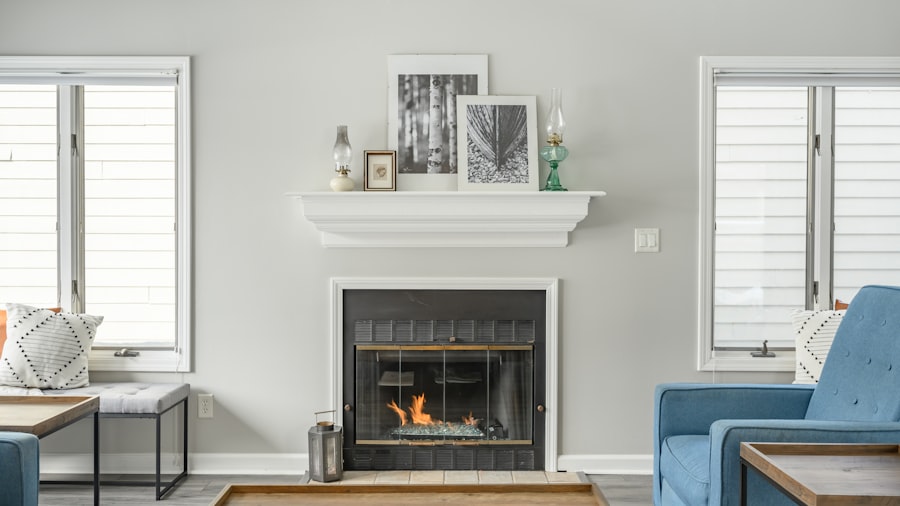bright living room with a lit white fireplace, a blue accent chair, and soft winter light