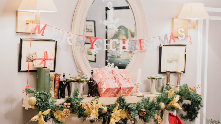 bright styled mantel with a merry christmas banner, fresh greenery, and pastel wrapped gifts below a round mirror
