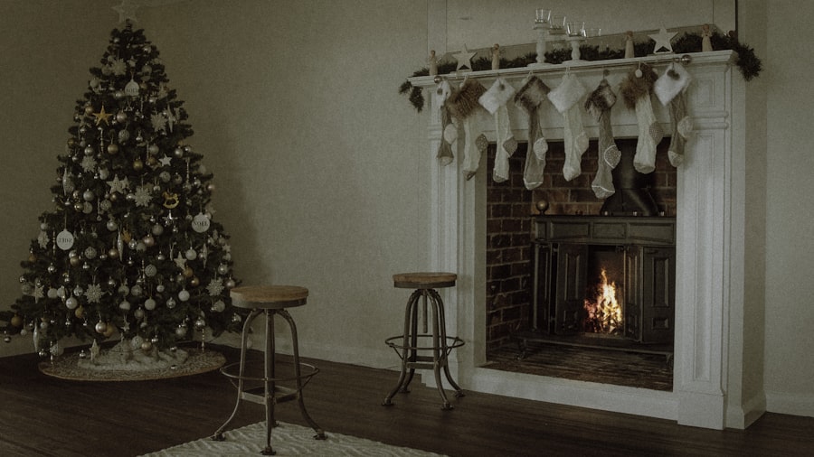 flocked Christmas tree beside a bright white fireplace hung with white stockings in a clean, minimal room