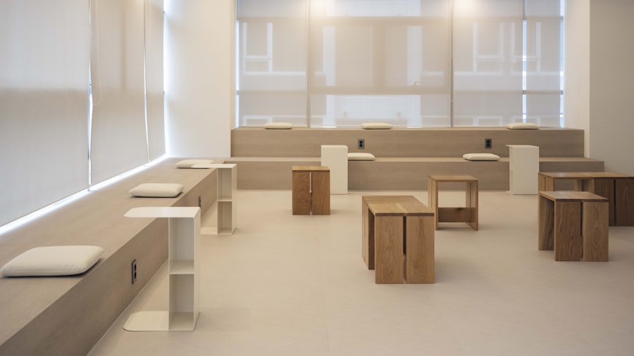 minimalist pale lounge with low wooden block seating and soft daylight