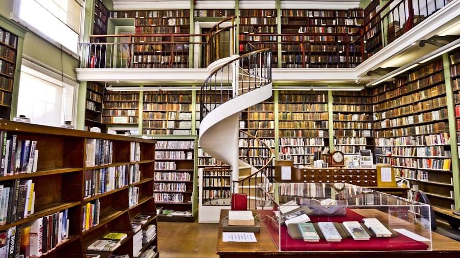 grand two-storey library with floor-to-ceiling bookshelves and a white spiral staircase