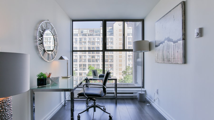 bright white corner office with a desk and chair beside floor-to-ceiling windows over the skyline
