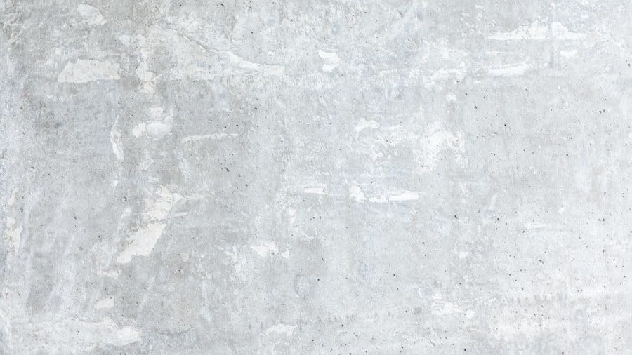 smooth light-grey concrete wall with subtle mottled texture