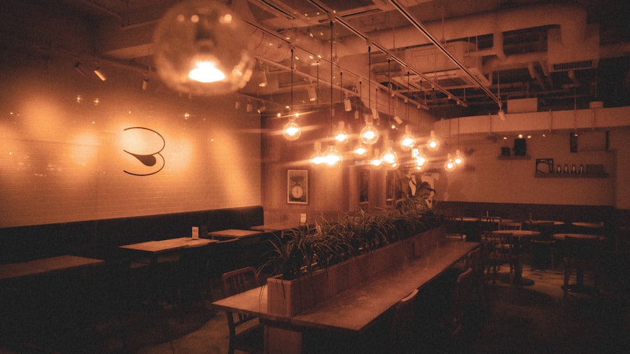 moody restaurant interior with a row of warm pendant lights softly out of focus