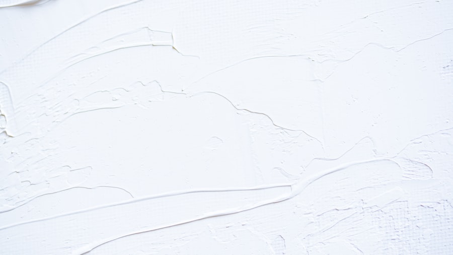 white plaster wall with subtle trowel-stroke texture